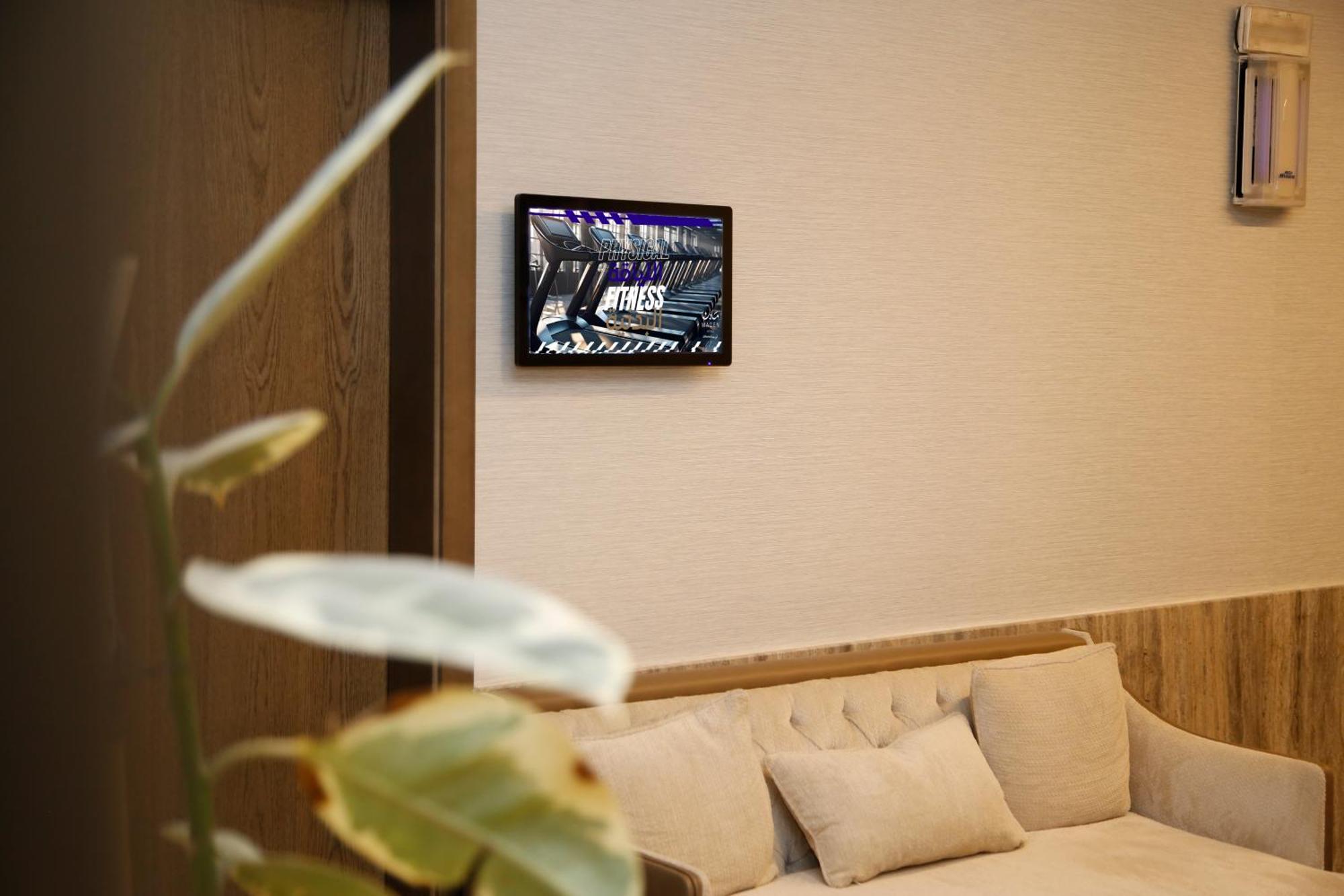 Maden Alrawda Hotel Medina Exterior foto A wall-mounted tablet
